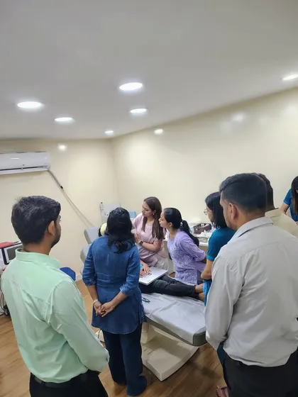This image captures the collaborative environment of my training sessions. A group of dedicated dermatologists observes a live demonstration, fostering a space for shared learning and in-depth discussion on advanced aesthetic applications.
