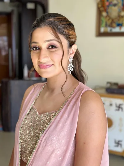 A close-up of her soft and pretty makeup. The focus is on creating a natural, healthy-looking glow that makes her feel polished and confident.