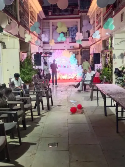 A view of the outdoor venue for the unicorn party, showing how we can decorate open spaces with ceiling balloons and a main stage.