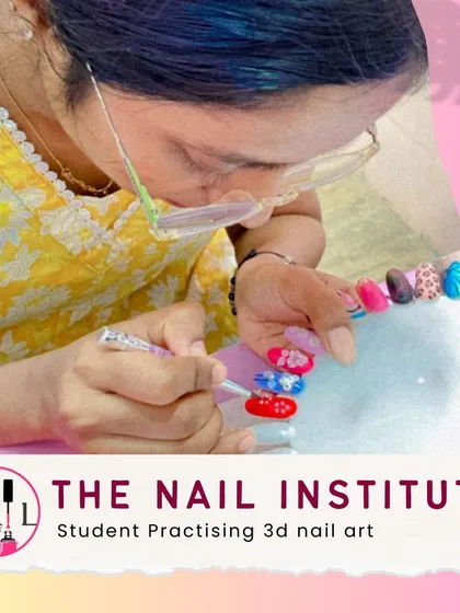 A student practices creating detailed 3D floral nail art, a popular and advanced technique that adds dimension to any manicure.
