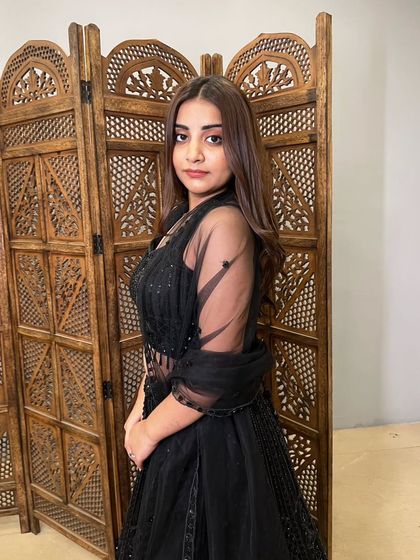 Another beautiful close-up, showing the sheer sleeve detail of this pre-loved black lehenga.