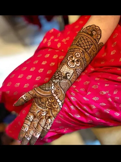 A single-arm view of a traditional design, showing the intricate details of the patterns and the beautiful peacock motif.