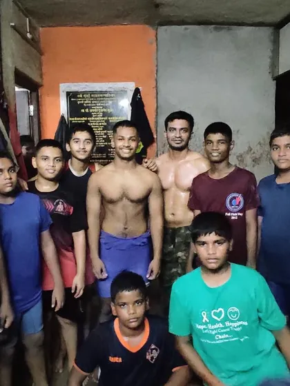 A group of our young and aspiring pailwans at the akhada. We are proud to be shaping the next generation of wrestlers, instilling values of hard work and respect.
