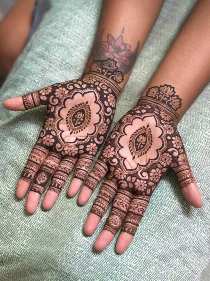 A beautiful cutwork design that plays with negative space. The lotus motif in the center is a classic touch.