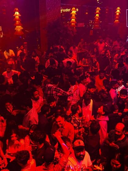 The dancefloor at Boho under intense red lighting. The mood is electric, and the crowd is packed in, ready for a night of non-stop dancing.