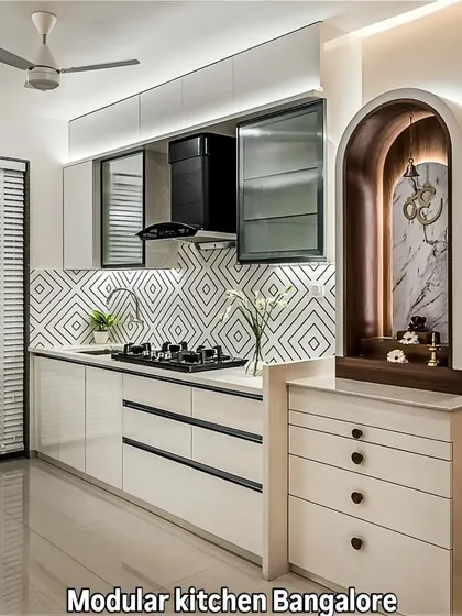 I can integrate unique personal elements into a modern kitchen design. This layout features a beautifully crafted pooja unit alongside sleek, handleless cabinetry and a patterned backsplash, blending tradition with contemporary style.