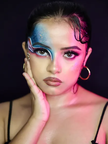 A creative, graphic eyeliner look with a wet-hair effect. This is an example of an editorial-style party look that pushes creative boundaries.