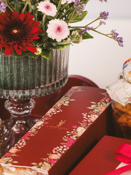 A close-up of our Imperial Tray, showcasing the rich floral packaging and a beautiful bouquet, making it a complete and elegant Diwali gift.