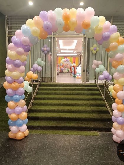 A classic balloon entrance arch in pastel colors. This is a great way to welcome guests and set a festive mood from the moment they arrive.