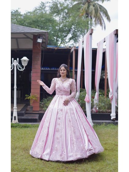 Another angle of the stunning pink gown, highlighting its voluminous skirt and elegant design. It’s a perfect choice for creating unforgettable photos and memories.