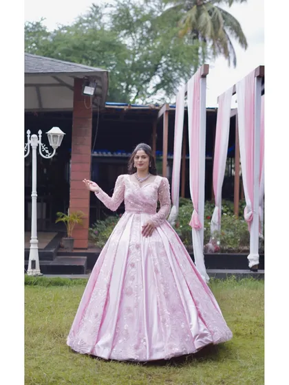 Another angle of the stunning pink gown, highlighting its voluminous skirt and elegant design. It’s a perfect choice for creating unforgettable photos and memories.