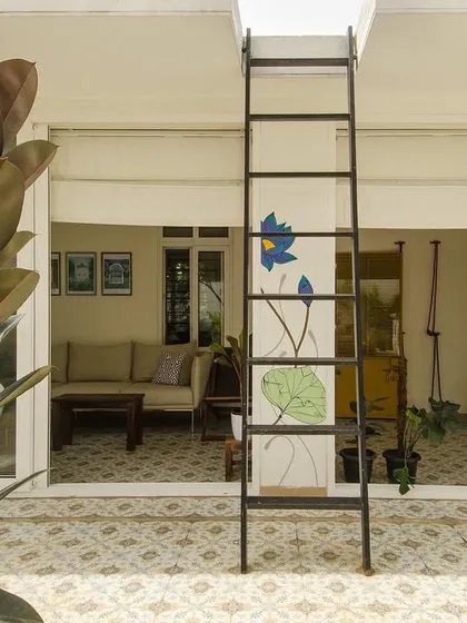 Where there is sun, there is light and life. This view through a skylit area shows how the home is designed to be as much about its outdoor spaces as its indoors, with life and greenery taking center stage.