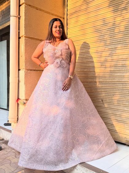 This pink ball gown has a subtle shimmer that catches the light beautifully. It's designed to make you feel elegant and special.