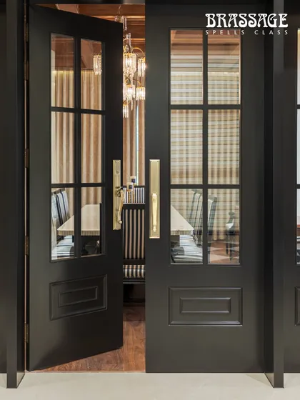 Another perspective of the Emperor set, showing how the light catches the curves of the brass, adding warmth and dimension to the dark doors.