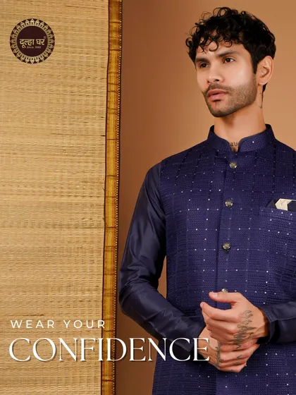 Wear your confidence. A navy blue embroidered Nehru jacket paired with a matching kurta, exuding a quiet and powerful confidence.