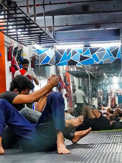 A glimpse into our BJJ and grappling class. Members practice techniques on the mat, learning how to use leverage and skill over brute force in a controlled, safe environment.