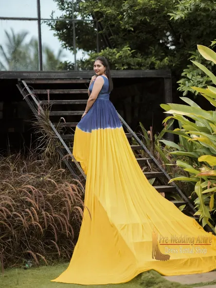 To make your photos unique, I offer dual-tone flying gowns. This piece combines a deep blue bodice with a bright yellow tail, creating a striking visual contrast that stands out in any setting, especially in natural, green environments.