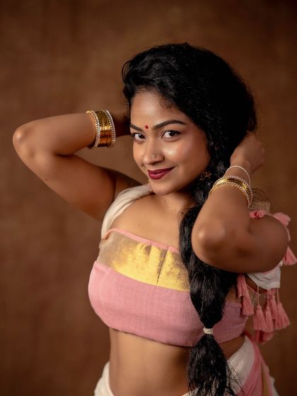 A close up portrait from my personal shoot. The traditional braid and simple jewelry complete this artistic and personal expression of my love for sarees.