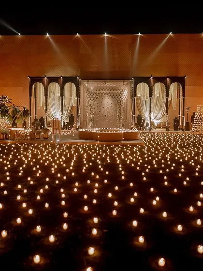 To create a truly magical Sufi night, we filled an entire lawn with thousands of candles. This simple yet powerful concept transformed the space into an enchanted, glittering landscape, providing a serene and soulful backdrop for the evening's performances.