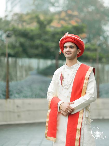 A classic portrait of a Maharashtrian groom in his wedding attire.
