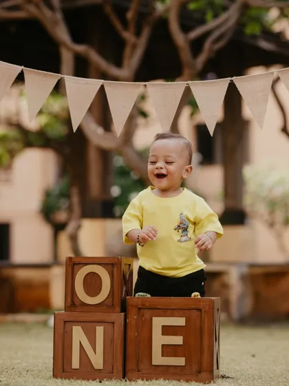 Pure excitement and laughter during a first birthday shoot. My goal is to capture the genuine expressions and playful energy of your child.