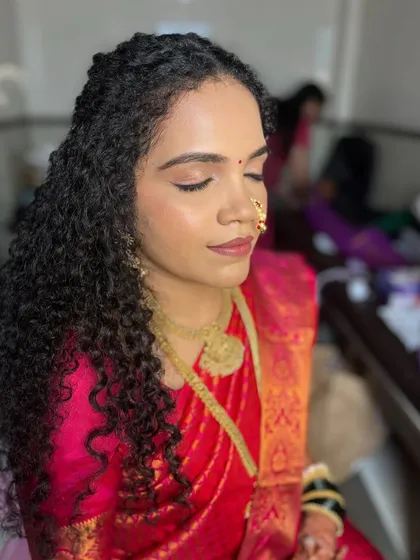 Makeup that looks like skin! I created this flawless, minimal, and dewy base for the beautiful Shivani. We kept her gorgeous natural curls open and just braided the front for an effortlessly chic look.