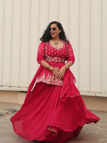 A full-length shot of my vibrant red outfit for a Mayra ceremony. This traditional event calls for a look that is both festive and elegant.