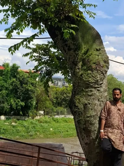 A moment of stillness by a tree on the banks of the Bagmati river. The natural surroundings of the temple are as sacred as the shrines themselves.