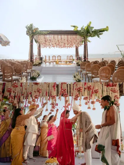 The final moments of the pheras, with family showering the couple with blessings and petals. This Goa beach wedding mandap, adorned with banana leaves and tuberose, was a beautiful blend of South Indian tradition and coastal charm.