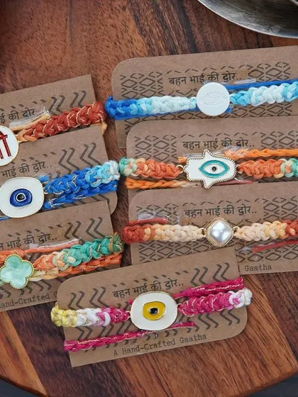 My full collection of charm rakhis, each with a unique centerpiece.