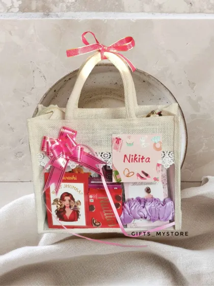 Because my girls deserve the best! A close-up of one of my bridesmaid proposal hampers, packed in a cute jute bag with a personalized tag for Nikita.