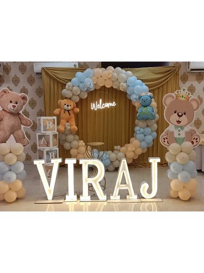 A full view of the teddy bear welcome setup, showing how all the elements like the ring backdrop, marquee letters, and props come together.