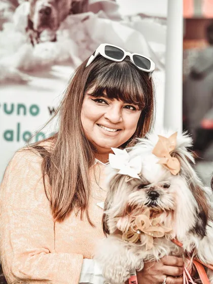 Bella the Shih Tzu, looking absolutely fabulous with her bows and a big smile from her mom. She was a true star at the pet festival, and it was a joy to capture her pampered and happy personality.