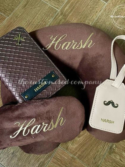 A perfectly coordinated travel set for him, featuring a rich brown color scheme. This set includes a personalized neck pillow, eye mask, passport cover, and luggage tag for stylish and comfortable journeys.