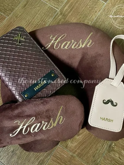 A perfectly coordinated travel set for him, featuring a rich brown color scheme. This set includes a personalized neck pillow, eye mask, passport cover, and luggage tag for stylish and comfortable journeys.