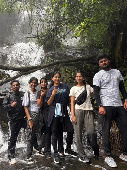 A group of friends posing for a picture in front of a beautiful waterfall during our Netravati trek. These are the moments that make the trip memorable.