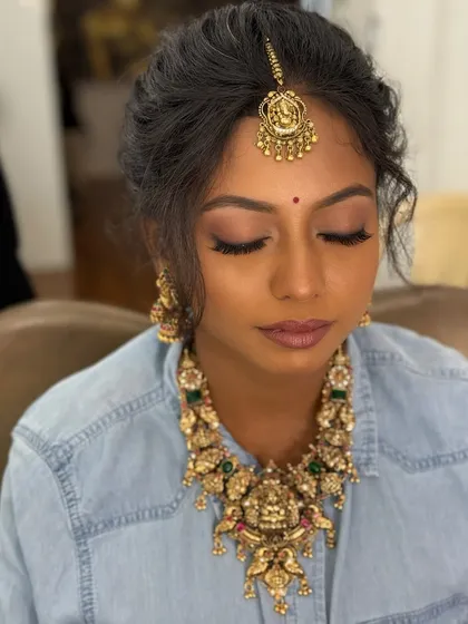 A unique shot of the bride-to-be in a casual shirt, but fully adorned with her engagement jewellery, showing how we try things out during the getting-ready process.