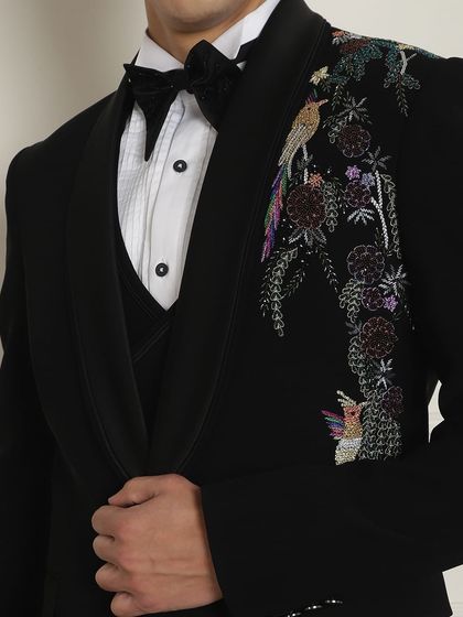 A detailed shot of the bird embroidery on the tuxedo jacket. This is how we customize our outfits to make them truly unique.