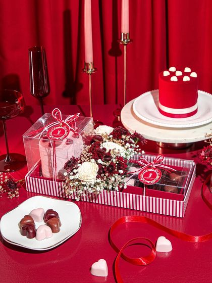 Our Valentine's Day hamper, a romantic spread of red velvet cake, heart-shaped chocolates, and fresh flowers. The perfect way to express your love.