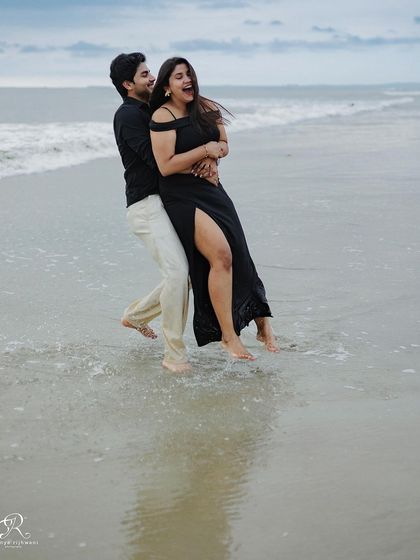 Another angle of their playful interaction in the water. Capturing a series of these moments helps to tell a more complete story of their fun-loving beach shoot.