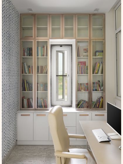 Study Nook Visualization: This series shows the transition from a 3D design of a compact study to the finished, installed space. The design prioritized maximizing storage with floor-to-ceiling glass cabinets and creating a comfortable, ergonomic workspace.