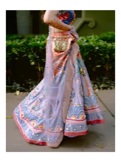 A detail shot of the bride's stunning, multi-colored Papa Don't Preach lehenga, a work of art in itself.