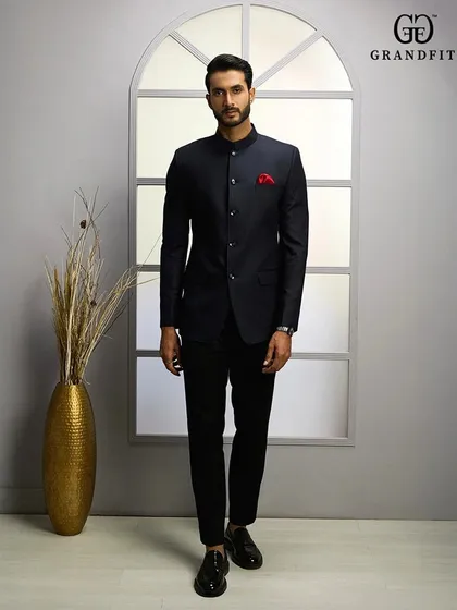 The modern gentleman's choice for formal occasions. Our custom-tailored navy Bandhgala suit offers a sharp, contemporary silhouette, meticulously crafted for a perfect fit.