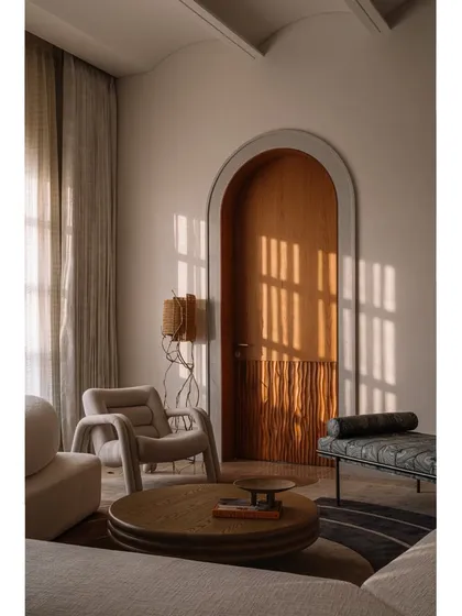 Our 'Hide N Seek' screen is furniture that invites play. Designed to divide a large suite into a salon and bedroom, its amoebic wooden panels have organic cutouts that frame views and create intriguing vignettes. It’s a sculptural piece that is both a space divider and an interactive art form.