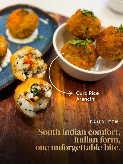 This is our Curd Rice Arancini. We took a beloved South Indian comfort food and gave it an Italian twist, creating a crisp, creamy appetizer with a surprise burst of mango pickle inside. It’s a perfect example of how we love to blend the familiar with the unexpected.