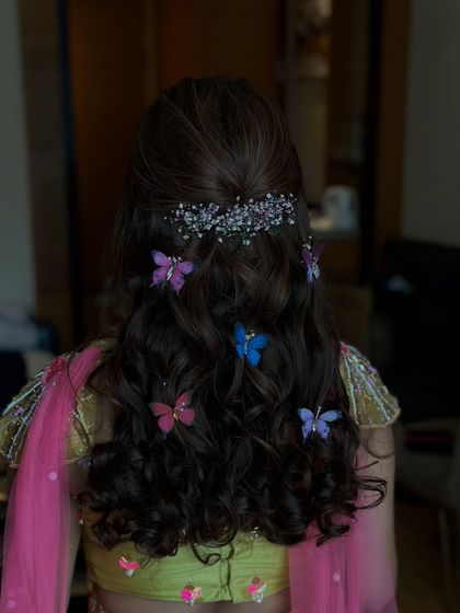 Another angle of the whimsical mehndi hairstyle, showing how the butterflies seem to float in the hair.