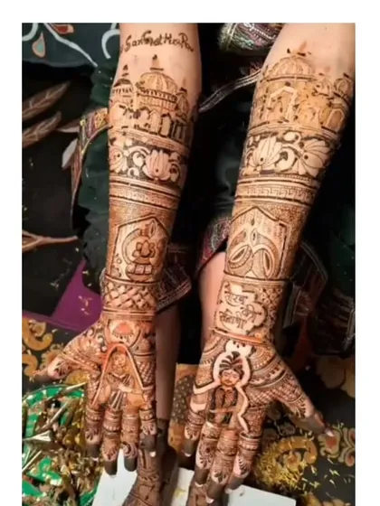 This design features portraits of the bride and groom on the palms, with the iconic Golden Temple of Amritsar drawn on the forearms, representing a place of significance for the couple.