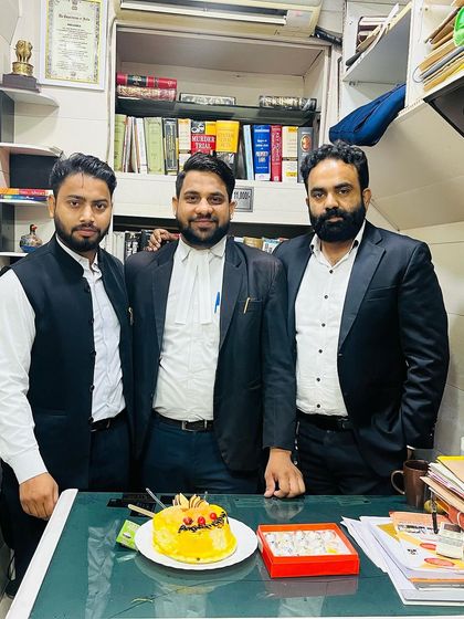 A moment with my team in our chamber, surrounded by law books and case files.