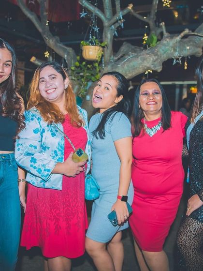 A group of friends enjoying the Christmas party.