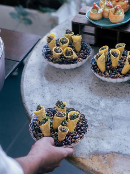 A tray of delicious appetizers, ready to be served to guests at one of our special events.